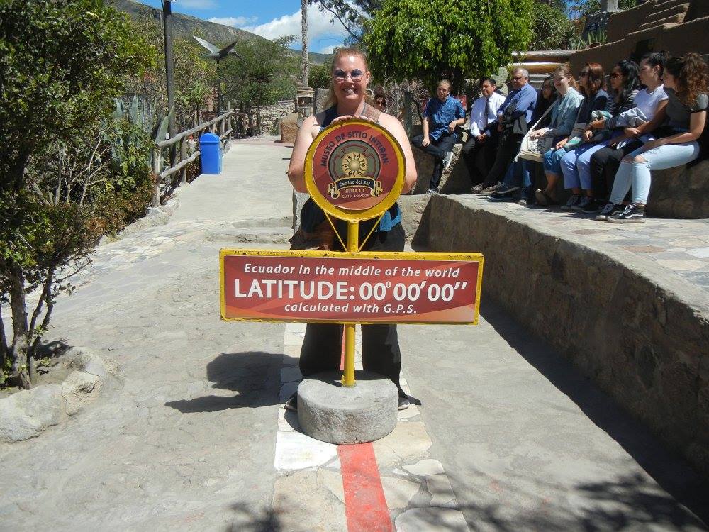 Samantha Hansen standing on the equator in Ecuador